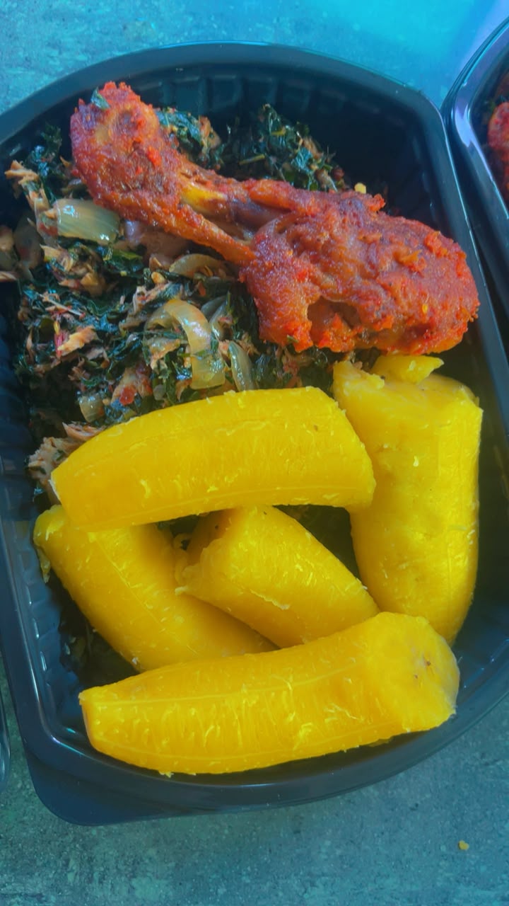 Boiled plantain with vegetable sauce, chicken and fish